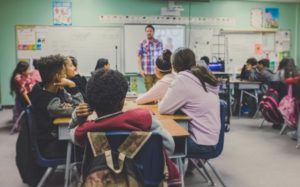 High school students listening to lecture in a classroom