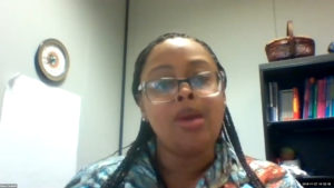 A black women in an office.